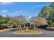 Exterior view of the community clubhouse with covered entrance and manicured landscaping at 4218 Club Course Dr, North Charleston, SC 29420