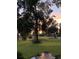 Scenic view of the golf course surrounded by lush greenery and beautiful trees at sunset at 4218 Club Course Dr, North Charleston, SC 29420