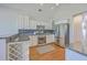 Bright eat-in kitchen with stainless steel appliances, granite countertops, and a wine rack at 4218 Club Course Dr, North Charleston, SC 29420