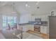 Bright kitchen featuring stainless appliances, granite countertops, a window and adjacent eat-in area at 4218 Club Course Dr, North Charleston, SC 29420