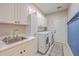 Well-equipped laundry room featuring modern appliances, ample storage, and stylish accents at 4218 Club Course Dr, North Charleston, SC 29420