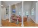 Open-concept living room with hardwood floors, built-in shelves, and a stone fireplace at 4218 Club Course Dr, North Charleston, SC 29420