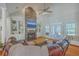 Cozy living room with stone fireplace, built-in shelving, and comfortable seating at 4218 Club Course Dr, North Charleston, SC 29420