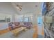 Comfortable living room with leather sectional, hardwood floors, and view to kitchen and dining area at 4218 Club Course Dr, North Charleston, SC 29420