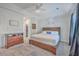 This main bedroom features a tray ceiling, ceiling fan and en-suite bath at 4218 Club Course Dr, North Charleston, SC 29420