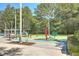Splash pad featuring brightly colored palm trees and a variety of interactive water features for entertainment at 4218 Club Course Dr, North Charleston, SC 29420