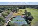 Aerial view of the tennis courts, parking and sports fields surrounded by lush landscaping and trees at 4218 Club Course Dr, North Charleston, SC 29420