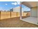 This home features a fully fenced backyard with a covered patio and manicured lawn at 446 White Scallop Way, Summerville, SC 29486