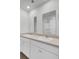 Bright bathroom featuring double sinks, white cabinets, and a large mirror at 446 White Scallop Way, Summerville, SC 29486