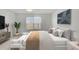 Comfortable bedroom with natural light, hardwood floors, a plush bed, and stylish furniture at 446 White Scallop Way, Summerville, SC 29486