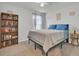 Inviting bedroom featuring a bookshelf and a window with sheer curtains at 446 White Scallop Way, Summerville, SC 29486
