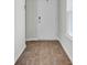 Entryway with wood-look flooring leading to a bright white door at 446 White Scallop Way, Summerville, SC 29486