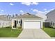 Charming single-story home with a two-car garage and a well-manicured front lawn at 446 White Scallop Way, Summerville, SC 29486