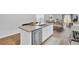 Contemporary kitchen with a kitchen island, stainless steel appliances, and an adjacent dining area at 446 White Scallop Way, Summerville, SC 29486