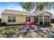 Inviting backyard with patio, table, and screened porch perfect for outdoor relaxation at 5024 Blair Rd, Summerville, SC 29483