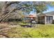 Spacious backyard featuring a grill, patio, and a screened porch perfect for entertaining at 5024 Blair Rd, Summerville, SC 29483