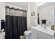 Bathroom featuring ample countertop space, a modern mirror and shower curtain at 5024 Blair Rd, Summerville, SC 29483