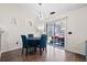 Cozy dining area featuring stylish lighting and sliding door to outdoor patio at 5024 Blair Rd, Summerville, SC 29483