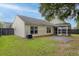 View of home's backyard showing vinyl siding and screened in porch at 5024 Blair Rd, Summerville, SC 29483