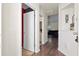 Inviting hallway with wood floors offering views into the living room and bathroom at 5024 Blair Rd, Summerville, SC 29483