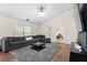 Cozy living room with plush sectional, stylish rug, and easy access to the bedroom at 5024 Blair Rd, Summerville, SC 29483