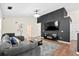 Comfortable living room featuring sectional, entertainment center and stylish decor at 5024 Blair Rd, Summerville, SC 29483