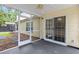 Screened porch featuring a view of the backyard, offering an ideal spot for outdoor dining or relaxation at 5024 Blair Rd, Summerville, SC 29483