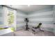 Bright exercise room featuring striped accent wall, large window, and exercise equipment at 503 Kitsap Ct, Summerville, SC 29486