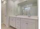 Bathroom with white cabinets, double sinks, large mirror, and enclosed shower at 513 Verdi Dr, Summerville, SC 29486