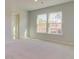 Sunlit bedroom showcases two large windows with a view of the natural landscape at 513 Verdi Dr, Summerville, SC 29486