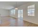 Open concept living room featuring wood floors, large windows, and sliding glass doors to patio at 513 Verdi Dr, Summerville, SC 29486