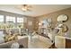 Well-decorated living room with many windows, comfortable seating, and lots of decor at 513 Verdi Dr, Summerville, SC 29486