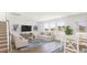 Bright living room with hardwood floors, large windows, and comfortable furnishings create a relaxing atmosphere at 519 Verdi Dr, Summerville, SC 29486