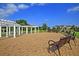 The community outdoor patio area features benches, and decorative pergola covered in mature trees at 519 Verdi Dr, Summerville, SC 29486