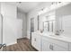 A bright bathroom features double sink vanity with modern fixtures, and walk in shower at 657 Cottage Landing Dr, Summerville, SC 29485
