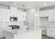 Bright kitchen featuring white cabinetry, modern appliances, pendant lighting, and a breakfast bar with quartz countertops at 657 Cottage Landing Dr, Summerville, SC 29485