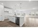 Modern kitchen with stainless steel appliances, sleek countertops, pendant lighting, and wood-look flooring at 657 Cottage Landing Dr, Summerville, SC 29485
