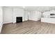 Bright open living space featuring a fireplace, recessed lighting, and a view into a modern kitchen at 657 Cottage Landing Dr, Summerville, SC 29485