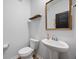 Powder room featuring a pedestal sink and modern fixtures at 707 Redbud Ln, Summerville, SC 29486