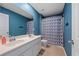Full bathroom with double vanity, toilet, and shower with a stylish curtain at 707 Redbud Ln, Summerville, SC 29486