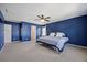 This bedroom boasts lots of space and bright, blue walls at 707 Redbud Ln, Summerville, SC 29486