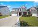 Charming two-story home with a well-manicured lawn and a two-car garage in a desirable neighborhood at 707 Redbud Ln, Summerville, SC 29486