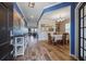 Elegant foyer with hardwood floors and tasteful decor, leading into the dining area and living spaces at 707 Redbud Ln, Summerville, SC 29486