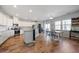 Bright kitchen features granite countertops, stainless steel appliances, and light hardwood floors at 707 Redbud Ln, Summerville, SC 29486