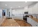 Well-lit kitchen showcasing granite countertops and stainless steel appliances at 707 Redbud Ln, Summerville, SC 29486