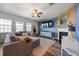 Comfortable living room with a cozy fireplace, perfect for relaxing and entertaining guests at 707 Redbud Ln, Summerville, SC 29486