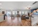 Spacious open-concept living area with ample natural light and seamless flow to the dining space at 707 Redbud Ln, Summerville, SC 29486