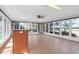 Bright sunroom with tile flooring, a ceiling fan, and expansive windows offering backyard views at 709 Chatter Rd, Mount Pleasant, SC 29464