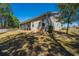 Spacious lawn with screened in porch and wooden fence at 718 Kilarney Rd, Summerville, SC 29483