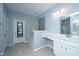 Bright bathroom featuring a large mirror, double sink vanity, bathtub, and tile flooring at 718 Kilarney Rd, Summerville, SC 29483